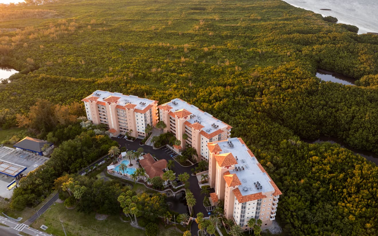 An aerial view of a large property with multiple buildings, showcasing the ability to manage multiple vacation rentals or properties through ThinkReservations.