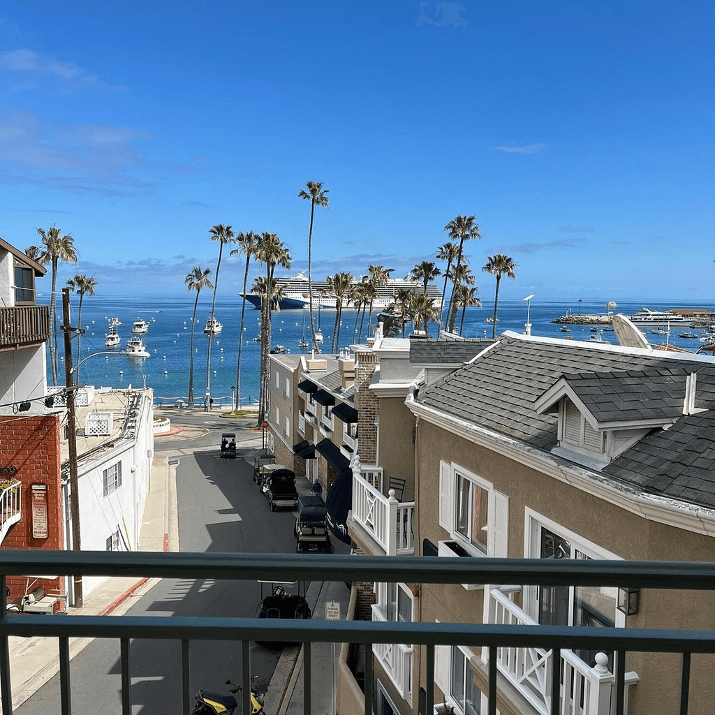 View of a cruise ship reaching Catalina Island from a Avalon Hotel balcony