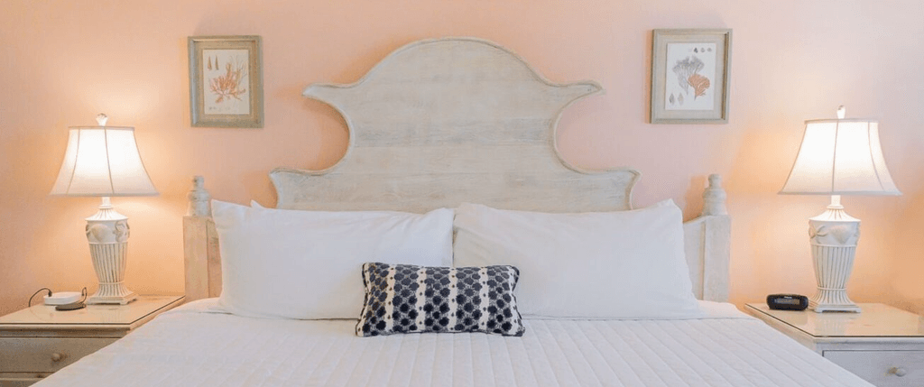 Interior of a hotel room showing a bed and nightstands.