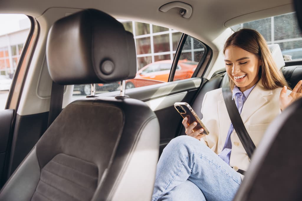 An Uber rider is using the Uber App to book a hotel
