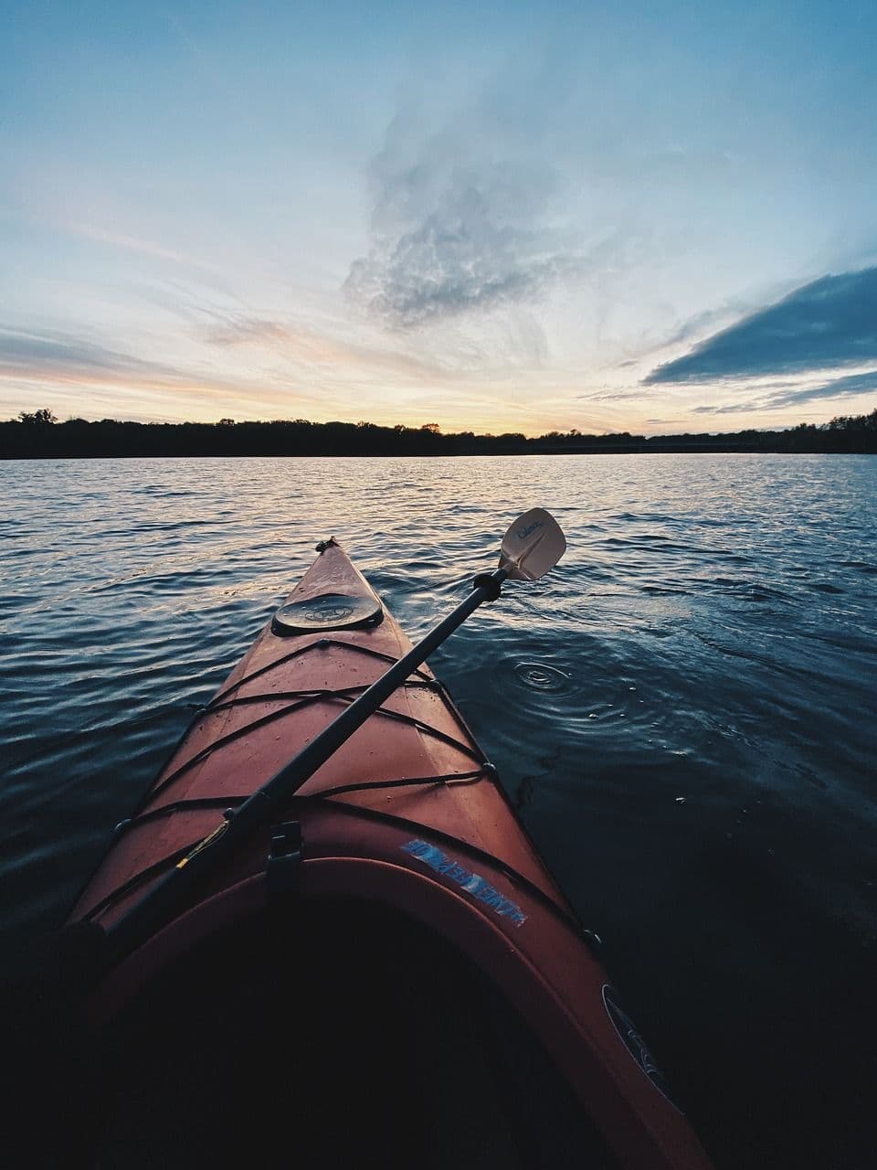 Person using a kayak in a lake