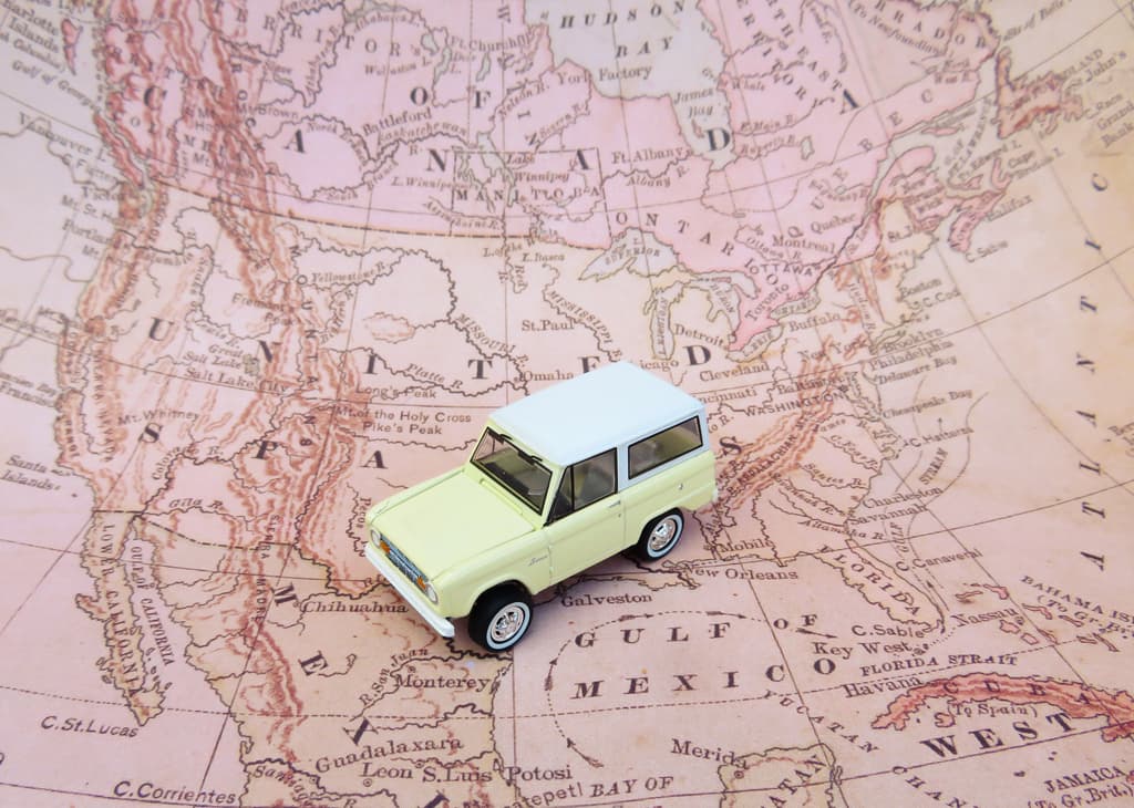 A printed map of north america with a toy truck on top of it. Image by <a href="https://pixabay.com/users/erikawittlieb-427626/?utm_source=link-attribution&utm_medium=referral&utm_campaign=image&utm_content=2530069">ErikaWittlieb</a> from <a href="https://pixabay.com//?utm_source=link-attribution&utm_medium=referral&utm_campaign=image&utm_content=2530069">Pixabay</a>