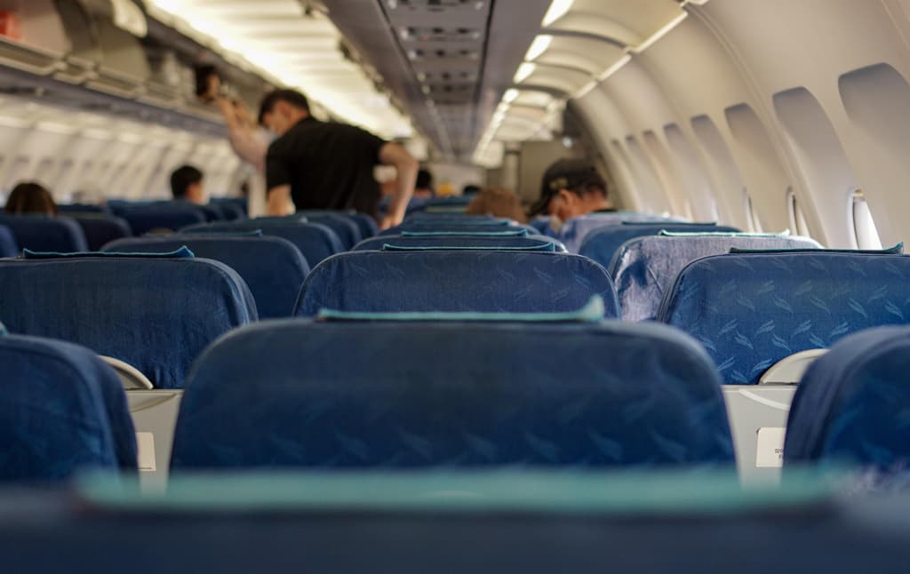 Image of rows of airline seats inside a commercial aircraft. Image by <a href="https://pixabay.com/users/juno1412-7661763/?utm_source=link-attribution&utm_medium=referral&utm_campaign=image&utm_content=5535467">JUNO KWON</a> from <a href="https://pixabay.com//?utm_source=link-attribution&utm_medium=referral&utm_campaign=image&utm_content=5535467">Pixabay</a>