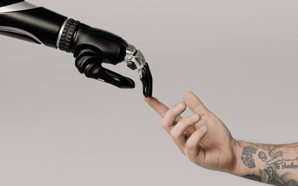 Bionic Hand and Human Hand Finger Pointing, by cottonbro studio