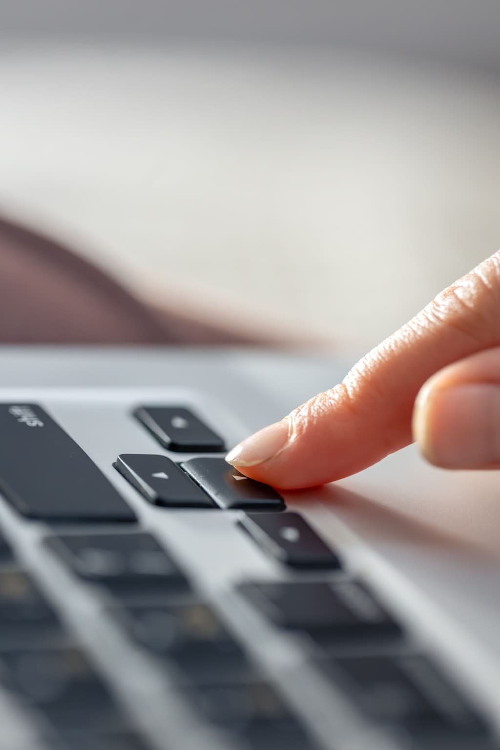 Hotelier typing into her computer