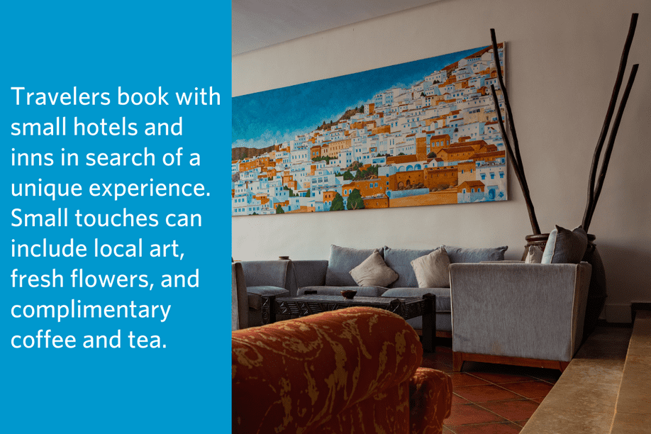 a living space with a larger painting of a coastal town above the couch and quote to the left: Travelers book with small hotels and inns in search of a unique experience. Small touches can include local art, fresh flowers, and complimentary coffee and tea.