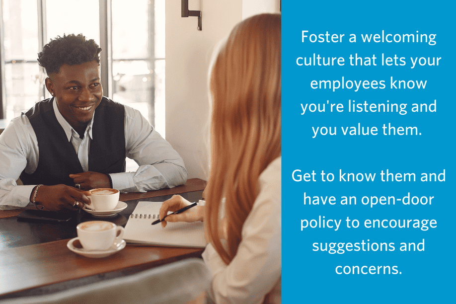 Two people sitting at a table across from each other appearing to have a conversation, one has a notebook and pen, ext reads Foster a welcoming culture that lets your employees know you're listening and you value them. Get to know them and have an open-door policy to encourage suggestions and concerns.