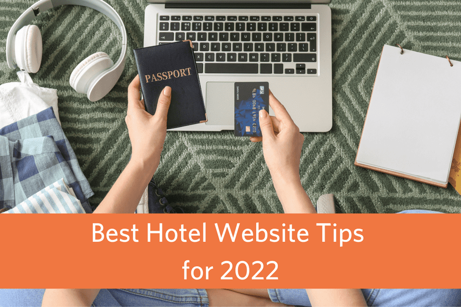 aerial view of person sitting on the floor at a laptop holding a credit card and passport with article title text overlay: Best Hotel Website Tips for 2022